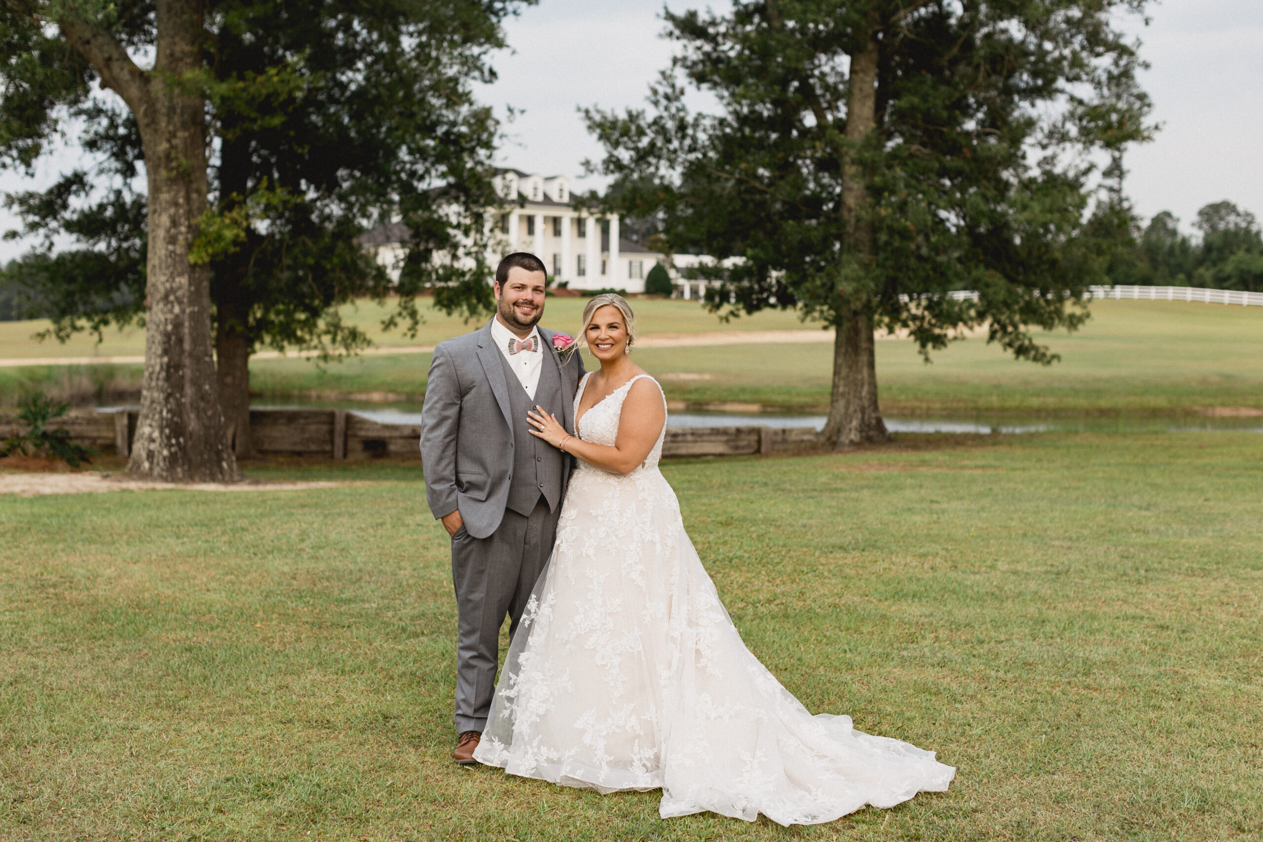 Bride and Groom posing in front of plantation home in Georgia